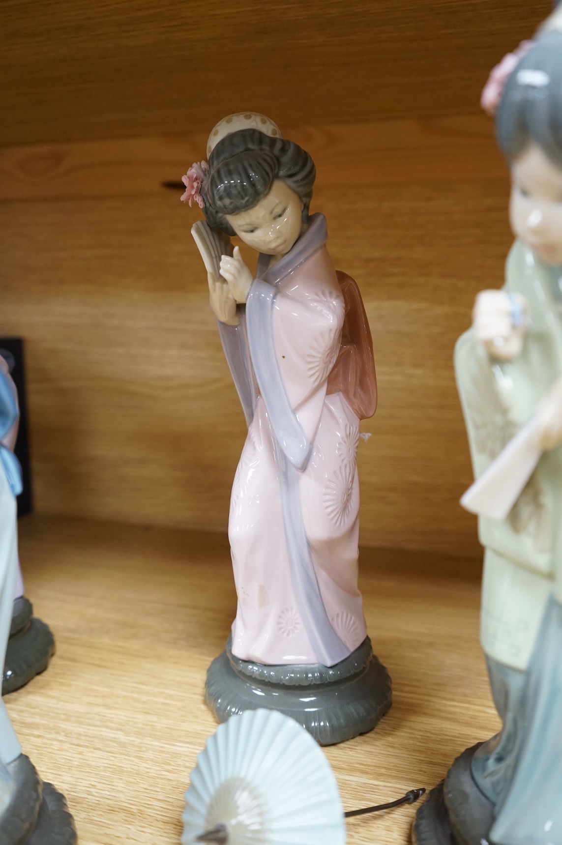 Four Lladro models of Geishas, tallest 30cm